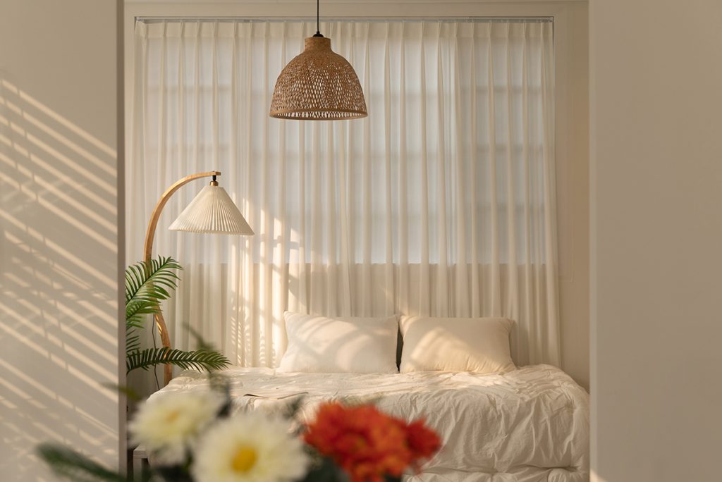 Rugmaker_Modern earth toned living room with marble coffee tables and crystal chandeliers.