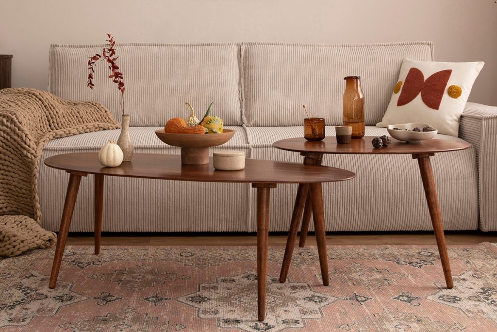 Rugmaker_Blog-Piece_Domestic interior of living room with mock up poster frame, modern sofa, oval wooden coffee table