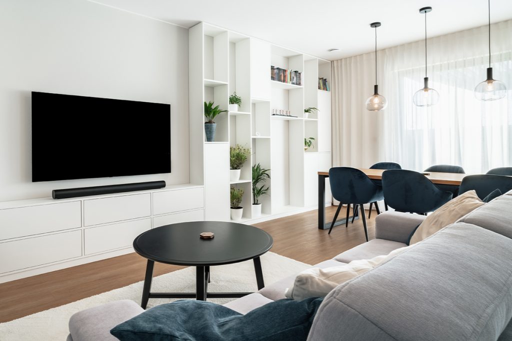 Rugmaker_Blog-Piece-SideImages_Modern living room with dining area in clean design with builtin furniture and window