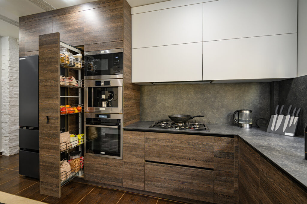 Rugmaker_Blog-Piece-SideImages_Modern large luxurious dark brown, gray and black cozy kitchen interior, big vertical dra