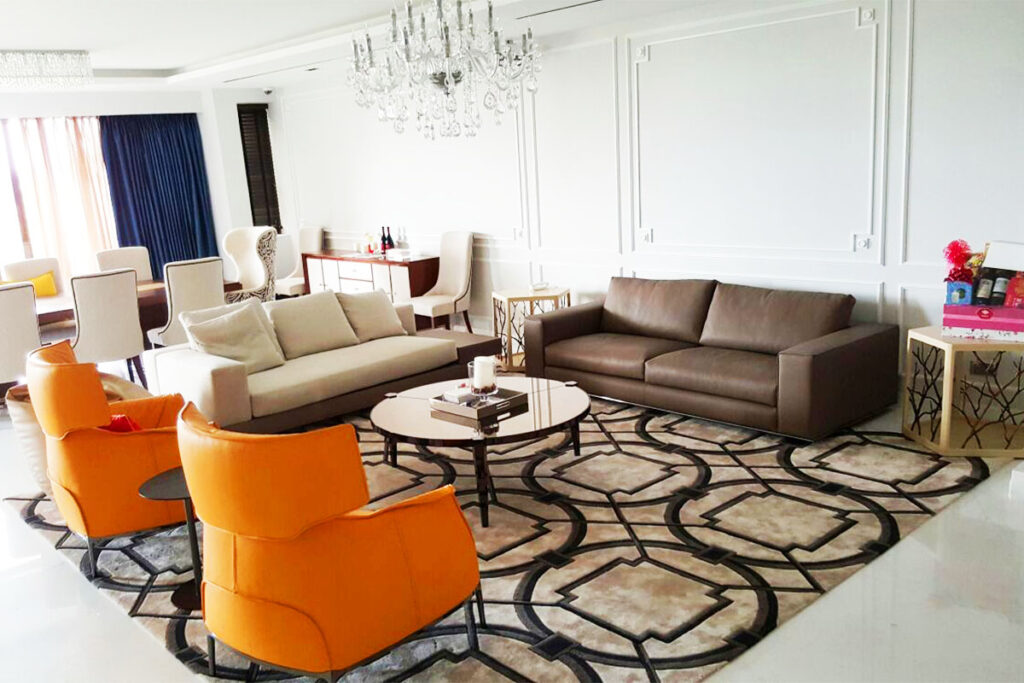Rugmaker_Blog-Piece-SideImages_Stylish rug with pattern and table on floor in living room, above view