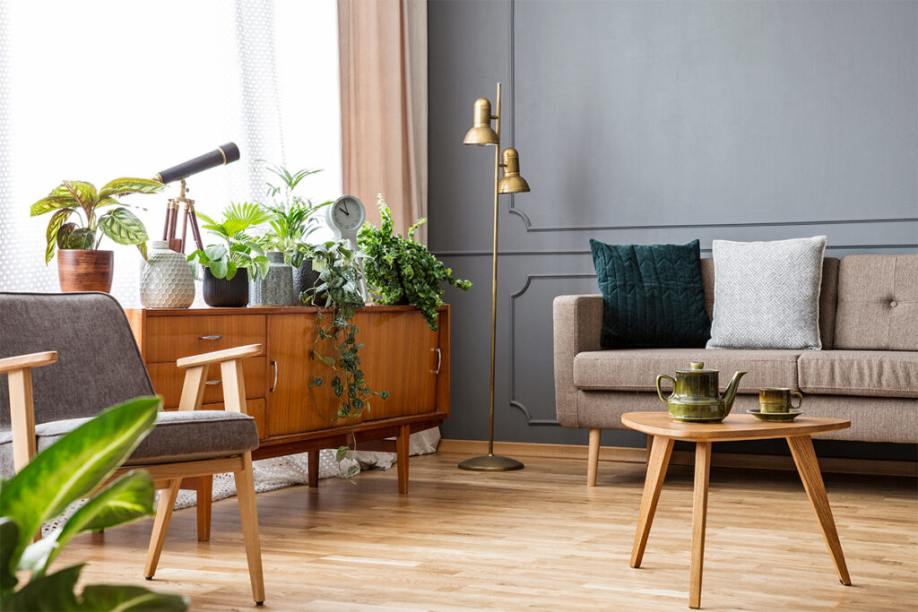 Rugmaker_Blog-Piece_Wooden table in vintage living room interior with cabinet between sofa and armchair