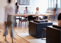 Rugmaker_Blog-Piece_Main Image_Business people at work in a busy luxury office space
