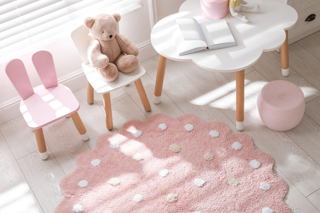 Rugmaker_Blog-Piece_Round pink rug on floor in children_s room, above view