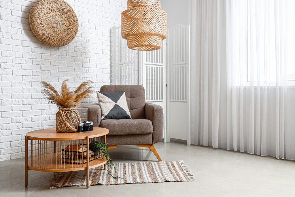 Interior of cozy living room with armchair and coffee table