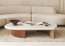 Rugmaker_Blog-Piece_Elegant and minimalist living room with beige curved sofa and wooden coffee table on a shaggy rug. 3