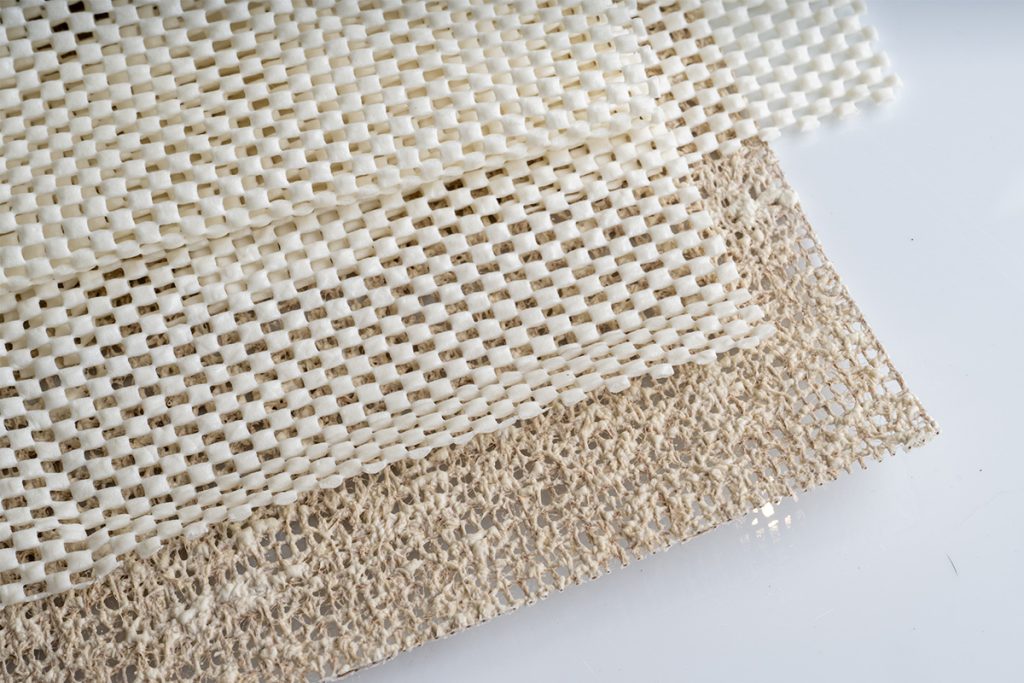 Rugmaker_Blog-Piece_Close up of Two Types of Textured Rug Pads. Polyvinyl Chloride and Rubber and Jute Eco Friendly Vers