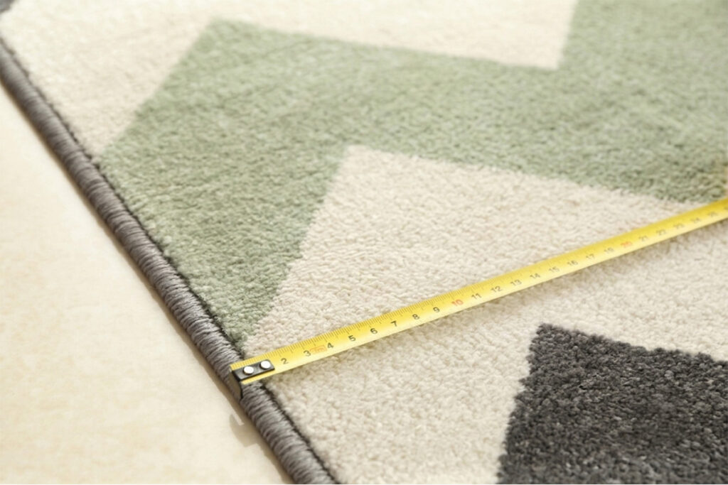 Rugmaker_Blog-Piece_Woman with tape measure on a rug